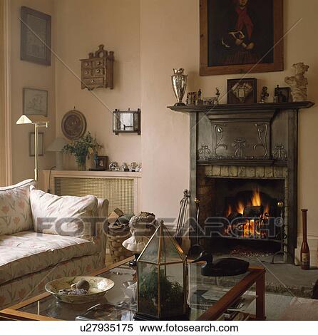 Art Nouveau Cast Iron Fireplace In Traditional Living Room Stock