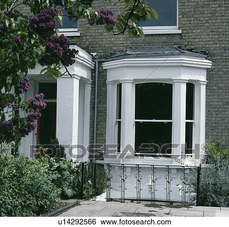 Stock Photograph - Bay window on traditional Victorian house. Fotosearch