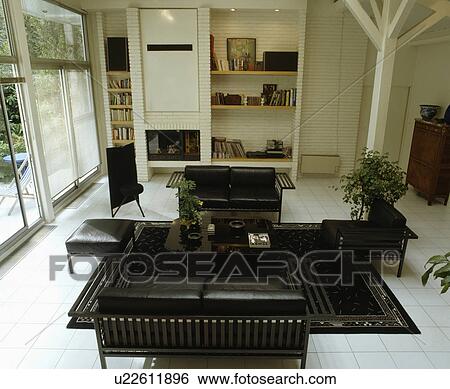 Black leather furniture in modern black+white living room View Large Photo Image Stock Photograph - Black leather furniture in modern black+white living room. Fotosearch