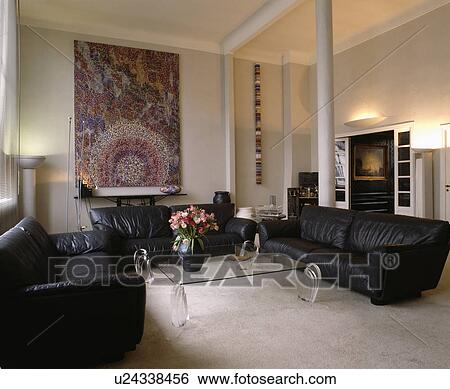 Stock Photograph - Black leather sofas in modern living room. Fotosearch