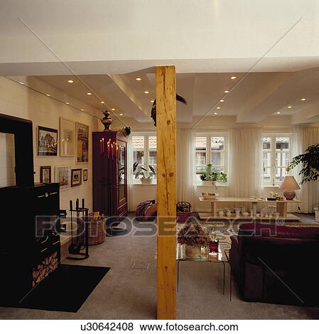 Black stove in seventies-style living room View Large Photo Image Stock Photo - Black stove in seventies-style living room. Fotosearch