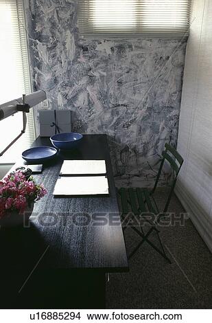 Black table and chair in eighties study with black+white paint effect wall View Large Photo Image Picture - Black table and chair in eighties study with black+white paint effect wall. Fotosearch