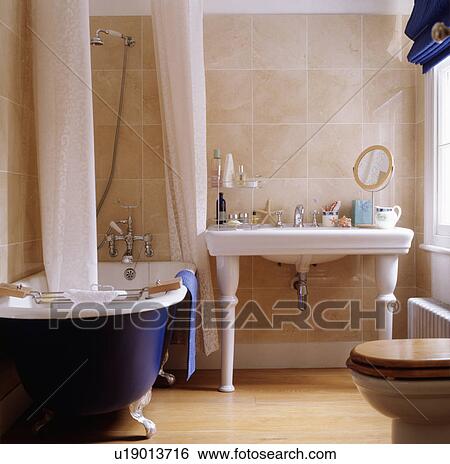 Stock Photograph - Blue bath in a bathroom. Fotosearch