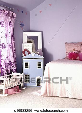 Blue dolls' house and mauve curtains in child's lilac bedroom View Large Photo Image Stock Photograph - Blue dolls' house and mauve curtains in child's lilac bedroom. Fotosearch