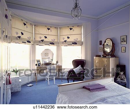 Blue townhouse bedroom with blue carpet and patterned cream blinds View Large Photo Image Stock Photograph - Blue townhouse bedroom with blue carpet and patterned cream blinds. Fotosearch