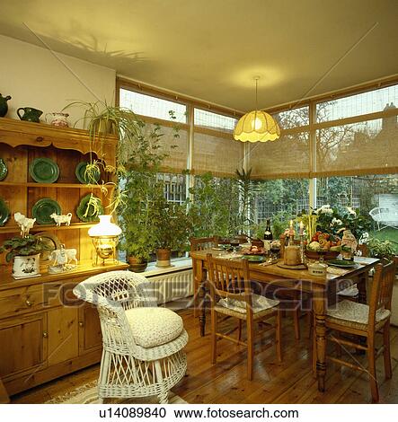 Stock Image - chair, interior, wicker, extension, houseplant, furniture, interiors. Fotosearch