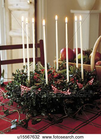 Christmas table centrepiece with holly and lighted candles. View Large Photo Image Stock Image - Christmas table centrepiece with holly and lighted candles.. Fotosearch