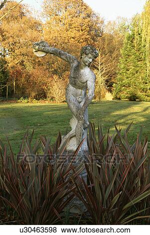 Classical statue in country garden in Autumn View Large Photo Image Stock Photo - Classical statue in country garden in Autumn. Fotosearch