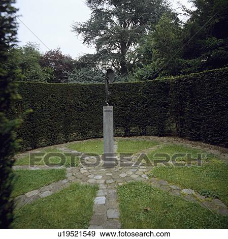 Clipped hedges in large country garden with sundial View Large Photo Image Stock Photo - Clipped hedges in large country garden with sundial. Fotosearch