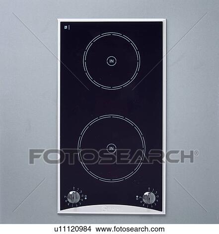 Close-up aerial view of black halogen hob View Large Photo Image Picture - Close-up aerial view of black halogen hob . Fotosearch