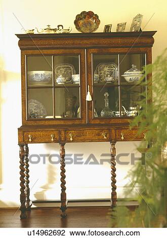 Close-up of antique walnut cabinet-on-stand View Large Photo Image Stock Image - Close-up of antique walnut cabinet-on-stand. Fotosearch
