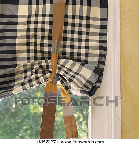 Stock Image - Close-up of black+white checked ruched blind. Fotosearch
