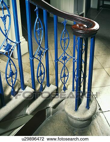 Close-up of blue metal bannisters and mahogany hand-rail on stone staircase View Large Photo Image Stock Image - Close-up of blue metal bannisters and mahogany hand-rail on stone staircase. Fotosearch