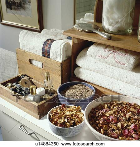 Close-up of bowls of potpourri and wooden storage box and shelves with white towels View Large Photo Image Stock Image - Close-up of bowls of potpourri and wooden storage box and shelves with white towels. Fotosearch