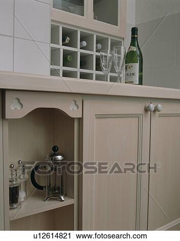 Close-up of cafetiere and salt and pepper mills on kitchen shelf with glasses and wine bottle above View Large Photo Image Stock Image - Close-up of cafetiere and salt and pepper mills on kitchen shelf with glasses and wine bottle above. Fotosearch