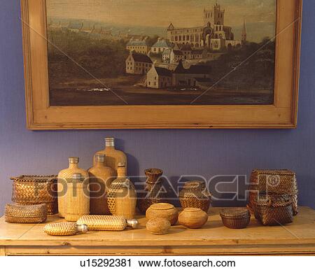 Close-up of collection of miniature wicker bottles below picture View Large Photo Image Stock Image - Close-up of collection of miniature wicker bottles below picture. Fotosearch