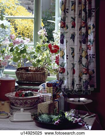 Stock Photography - Close-up of floral curtains at kitchen window. Fotosearch