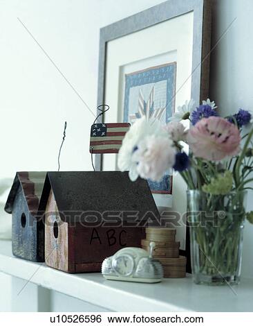 Close-up of folk-style birdhouses and fresh flowers View Large Photo Image Stock Photograph - Close-up of folk-style birdhouses and fresh flowers. Fotosearch