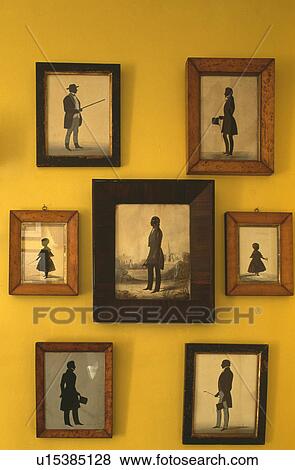 Stock Photo - Close-up of framed black+white silhouettes on wall. Fotosearch