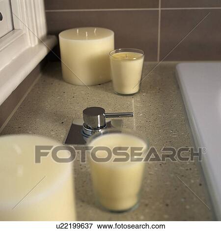 Close up of group of candles beside stainless steel bath tap View Large Photo Image Stock Photo - Close up of group of candles beside stainless steel bath tap. Fotosearch