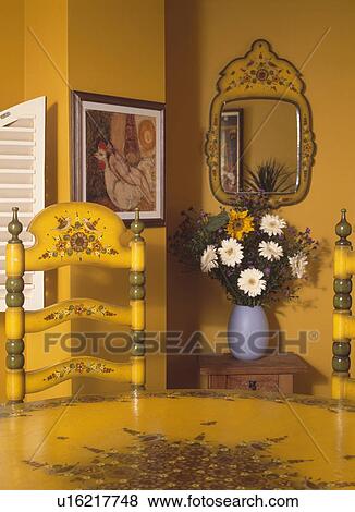 Stock Photo - Close up of hand painted floral pattern on Spanish style yellow chair and table. Fotosearch