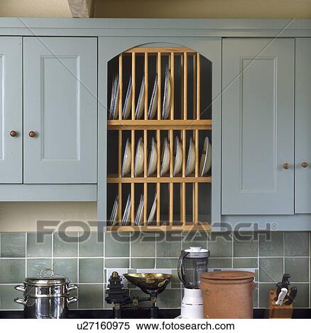 Close-up of integral plate rack in pastel blue kitchen View Large Photo Image Stock Photography - Close-up of integral plate rack in pastel blue kitchen. Fotosearch