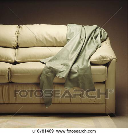 Close-up of leather throw on cream leather sofa View Large Photo Image Stock Photo - Close-up of leather throw on cream leather sofa. Fotosearch