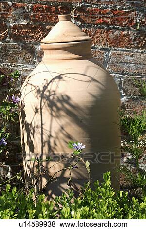 Close up of lidded terracotta pot View Large Photo Image Stock Photo - Close up of lidded terracotta pot . Fotosearch