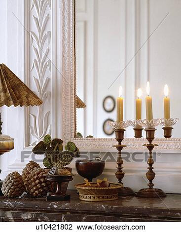 Close-up of lighted candles in front of mirror View Large Photo Image Stock Image - Close-up of lighted candles in front of mirror. Fotosearch