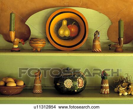 Close-up of Mexican pottery on green shelves View Large Photo Image Picture - Close-up of Mexican pottery on green shelves. Fotosearch