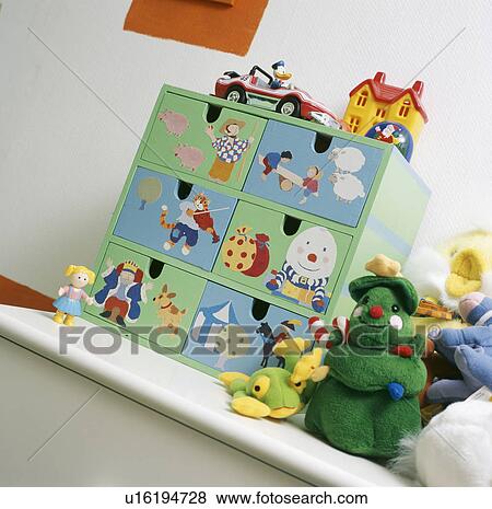 Close-up of miniature painted drawer unit with nursery rhyme figures on shelf with soft toys View Large Photo Image Stock Photo - Close-up of miniature painted drawer unit with nursery rhyme figures on shelf with soft toys. Fotosearch