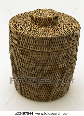 Picture - close-up of OKA rattan ice bucket. Fotosearch