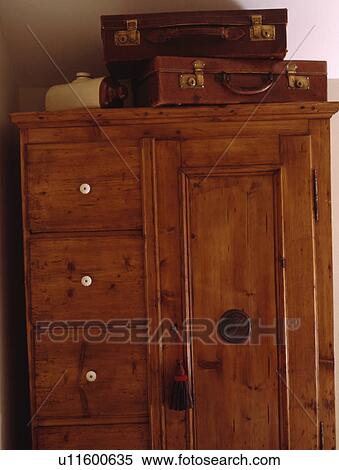 Close-up of old leather suitcases on top of pine cupboard View Large Photo Image Stock Photography - Close-up of old leather suitcases on top of pine cupboard. Fotosearch