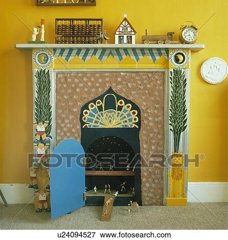 Close-up of painted fireplace with shelves in grate with open blue door View Large Photo Image Stock Photo - Close-up of painted fireplace with shelves in grate with open blue door. Fotosearch
