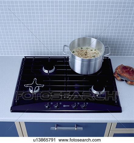 Close-up of pan of food on black gas hob View Large Photo Image Stock Image - Close-up of pan of food on black gas hob . Fotosearch