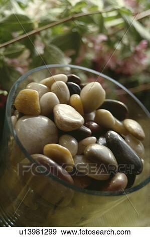 Close-up of pebbles in glass bowl View Large Photo Image Stock Photo - Close-up of pebbles in glass bowl . Fotosearch
