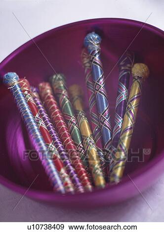 Close-up of pens wrapped in colourful silk View Large Photo Image Stock Photo - Close-up of pens wrapped in colourful silk. Fotosearch