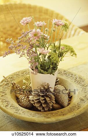 Picture - Close-up of pink flower arrangement and pinecones. Fotosearch