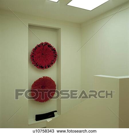 Close-up of red circular abstract sculpture in alcove on modern white landing View Large Photo Image Stock Image - Close-up of red circular abstract sculpture in alcove on modern white landing. Fotosearch