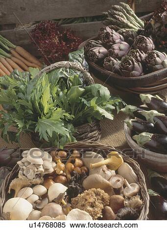 Close up of selection of mushrooms in basket and artichokes with salad greens View Large Photo Image Stock Photography - Close up of selection of mushrooms in basket and artichokes with salad greens. Fotosearch