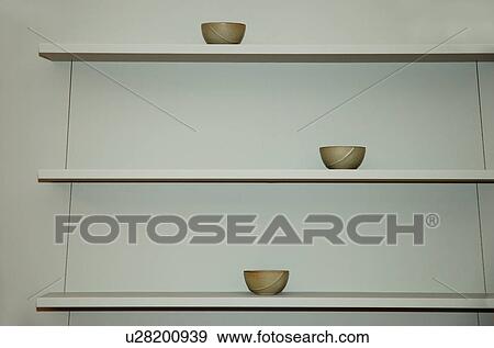 Close-up of small bowls on modern white shelves View Large Photo Image Stock Photo - Close-up of small bowls on modern white shelves. Fotosearch