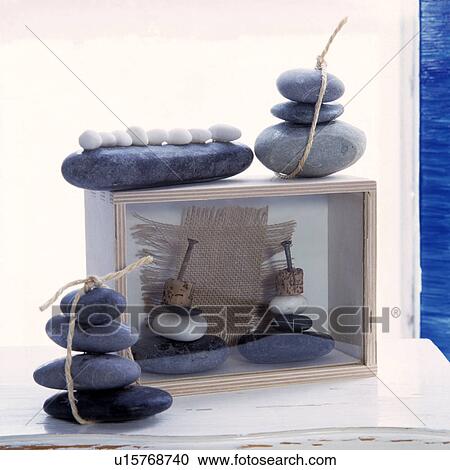 Close-up of smooth seashore pebbles on wooden boxes View Large Photo Image Stock Image - Close-up of smooth seashore pebbles on wooden boxes. Fotosearch