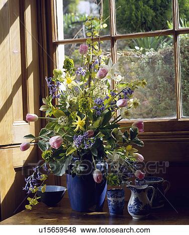 Stock Photo - Close-up of spring floral arrangement on windowsill. Fotosearch