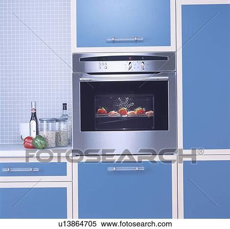 Close-up of stainless steel oven in modern blue kitchen unit View Large Photo Image Stock Photography - Close-up of stainless steel oven in modern blue kitchen unit . Fotosearch