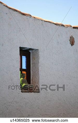 Close up of statue of Buddha on windowsill in rough cast wall View Large Photo Image Stock Photography - Close up of statue of Buddha on windowsill in rough cast wall. Fotosearch