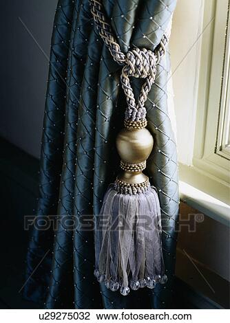 Close-up of tassel on grey curtain View Large Photo Image Stock Image - Close-up of tassel on grey curtain. Fotosearch