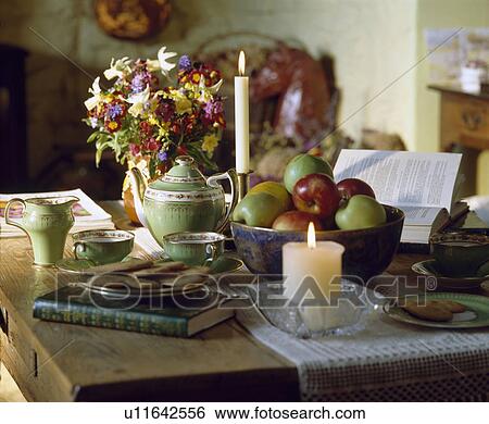 Stock Photograph - Close-up of teapot with green teaset on table. Fotosearch