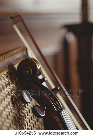 Stock Photograph - Close-up of violin pegs and strings . Fotosearch