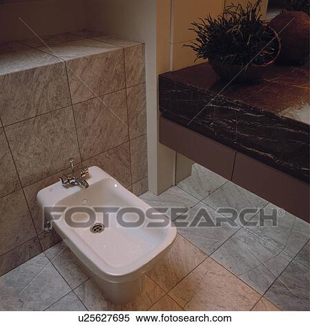 Close-up of white bidet and marble tiles View Large Photo Image Stock Photography - Close-up of white bidet and marble tiles. Fotosearch
