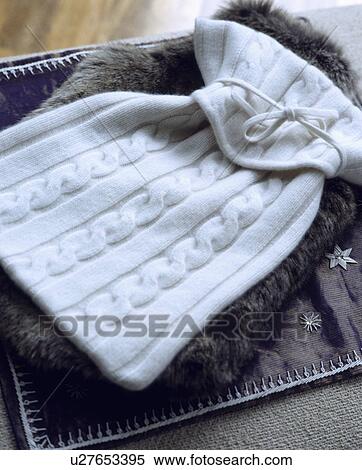 close-up of white cashmere and grey faux fur hotwater bottle covers View Large Photo Image Stock Photography - close-up of white cashmere and grey faux fur hotwater bottle covers. Fotosearch